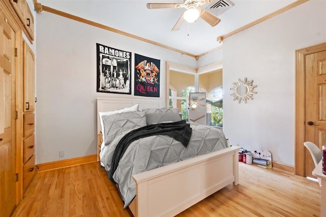 bedroom featuring ceiling fan, ornamental molding, and light hardwood / wood-style flooring