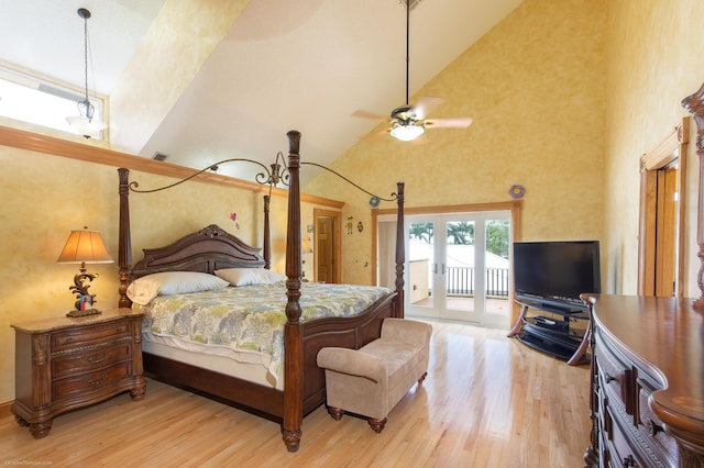 bedroom featuring french doors, high vaulted ceiling, light hardwood / wood-style floors, and access to exterior