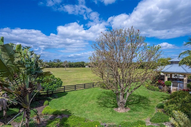 view of yard featuring a gazebo and a rural view