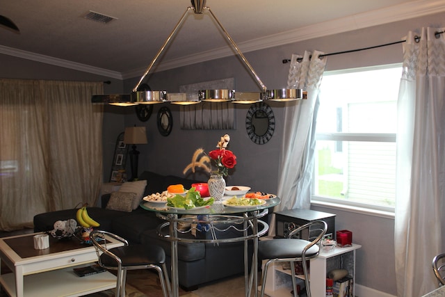 dining room featuring ornamental molding