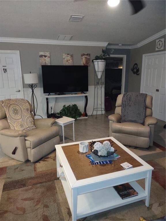 living room featuring crown molding