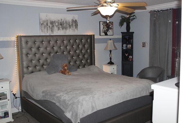 carpeted bedroom featuring ceiling fan and ornamental molding