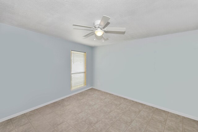 empty room featuring a textured ceiling and ceiling fan