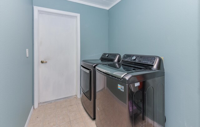 washroom with washing machine and clothes dryer