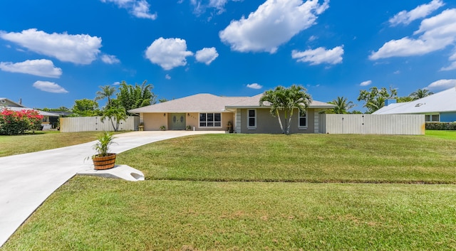 single story home featuring a front yard