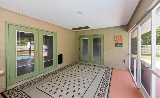 sunroom / solarium with french doors and a healthy amount of sunlight