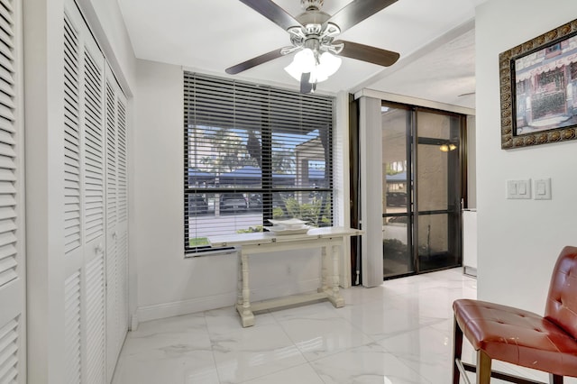 interior space featuring ceiling fan