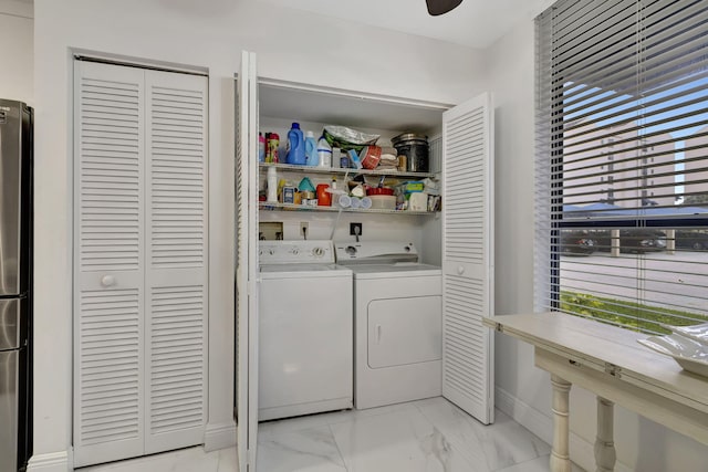 washroom with separate washer and dryer and ceiling fan