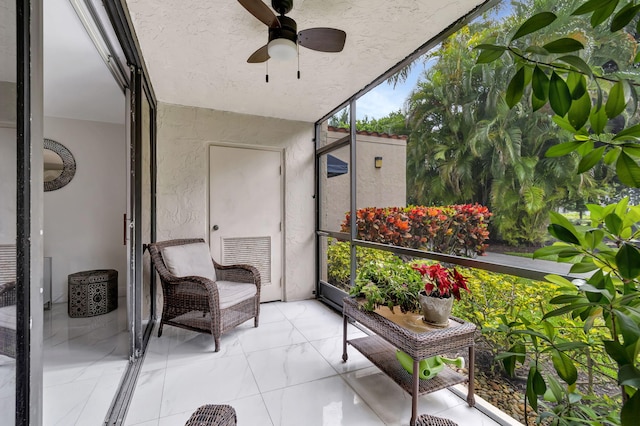 sunroom / solarium with ceiling fan