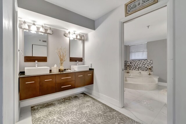 bathroom featuring vanity and a tub