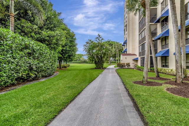 view of community featuring a lawn