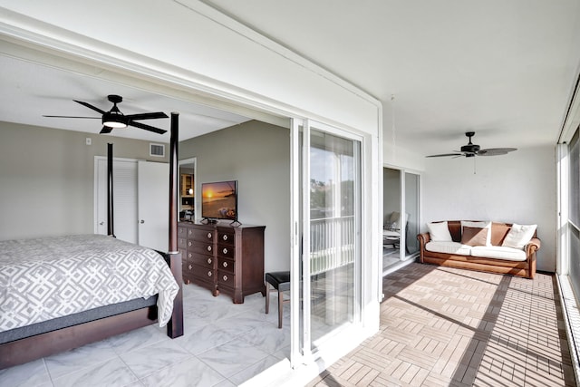 bedroom with ceiling fan and multiple windows