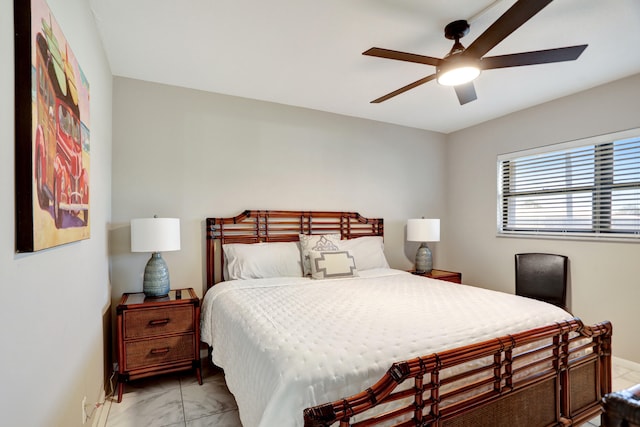 tiled bedroom with ceiling fan