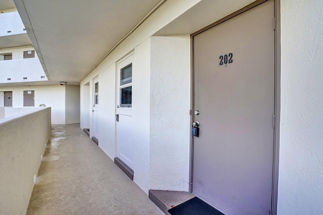 property entrance with a balcony