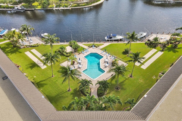 birds eye view of property with a water view