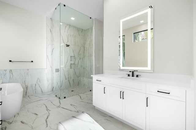 bathroom featuring tile walls, separate shower and tub, and vanity