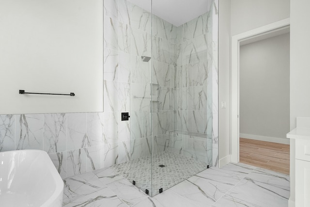 bathroom with independent shower and bath and tile walls