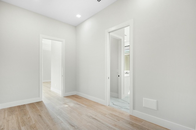 spare room with light wood-type flooring