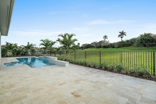 view of pool featuring a patio and a lawn