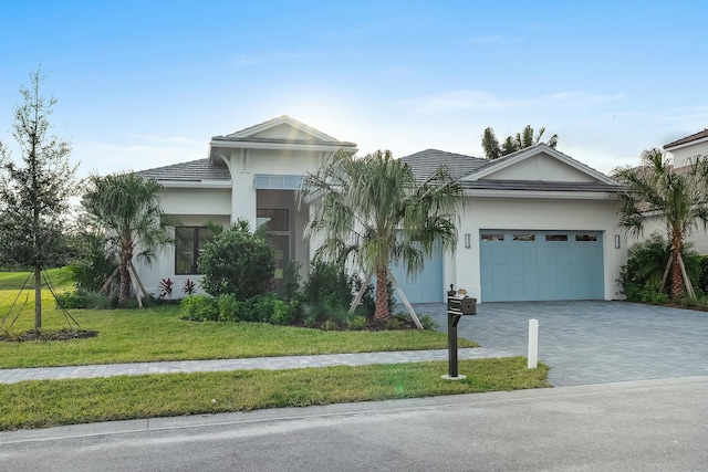 single story home featuring a front yard and a garage