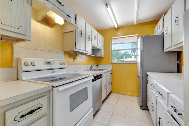 kitchen featuring white cabinetry, sink, stainless steel appliances, light tile patterned flooring, and exhaust hood