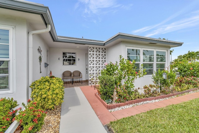 property entrance featuring a patio area