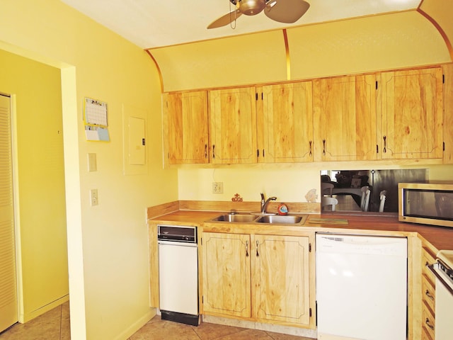 kitchen featuring ceiling fan, sink, light tile floors, dishwasher, and white dishwasher