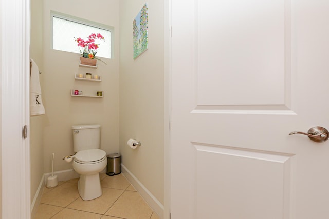 bathroom featuring toilet and tile flooring