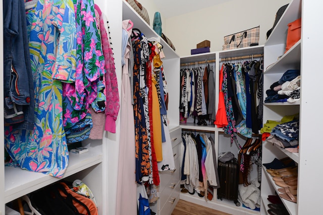 spacious closet featuring light wood-type flooring