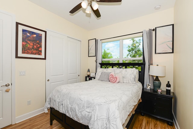 bedroom featuring a closet, ceiling fan, and light wood-type flooring