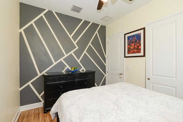 bedroom featuring ceiling fan and wood-type flooring