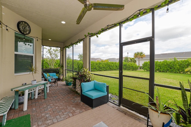 sunroom / solarium with ceiling fan