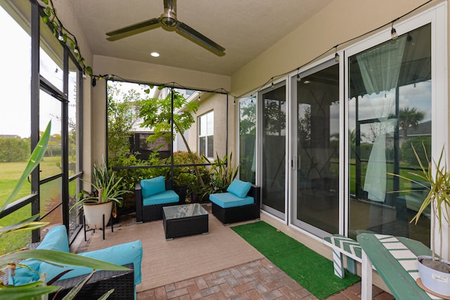 sunroom / solarium with ceiling fan