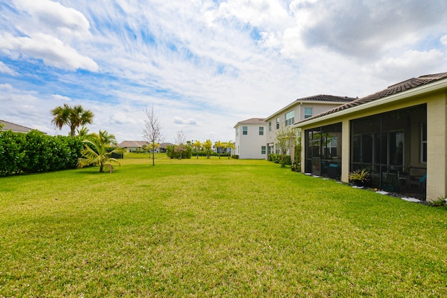 view of yard with a sunroom