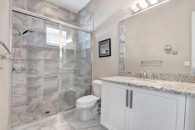 bathroom with tile floors, walk in shower, toilet, and vanity