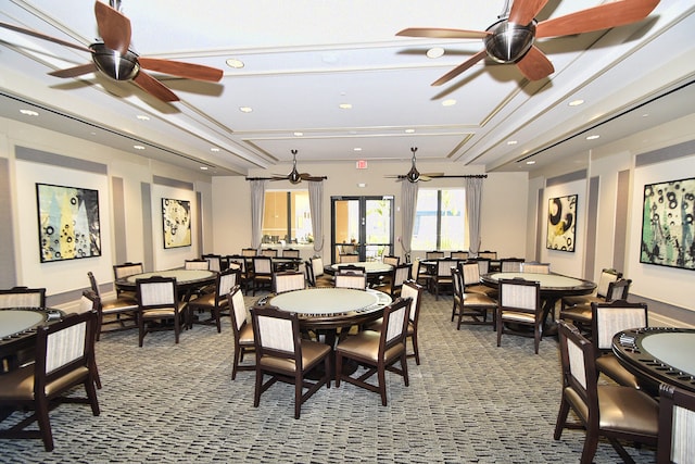 carpeted dining space featuring ceiling fan