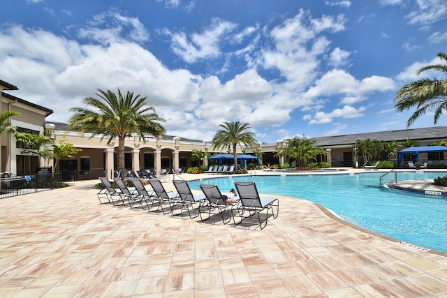 view of swimming pool featuring a patio