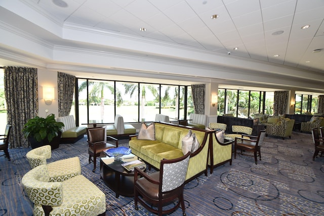 living room featuring ornamental molding and a tray ceiling