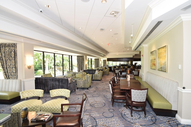 dining room featuring crown molding