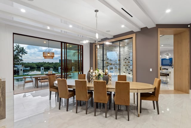 dining room featuring beamed ceiling and visible vents