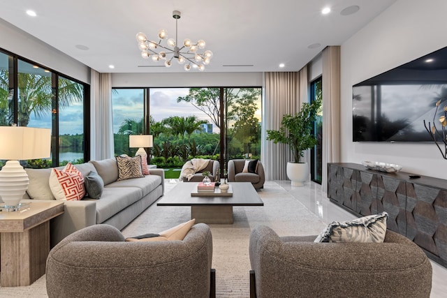 living room with recessed lighting, a notable chandelier, and a healthy amount of sunlight