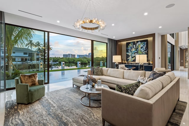 living area with a city view, an inviting chandelier, and recessed lighting