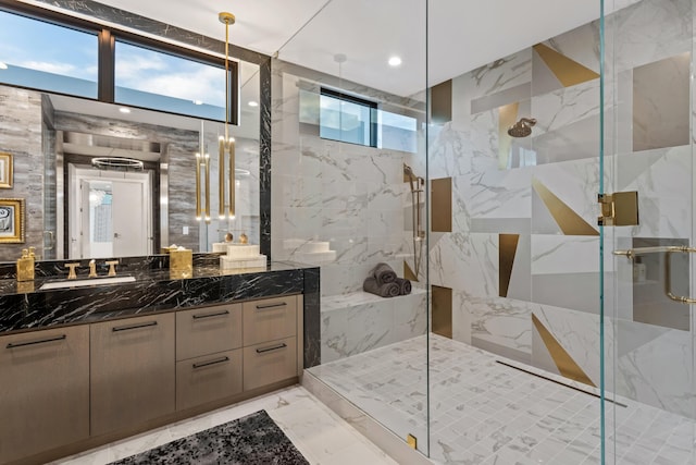 full bathroom with a marble finish shower, recessed lighting, marble finish floor, and vanity