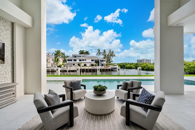 outdoor pool featuring a water view