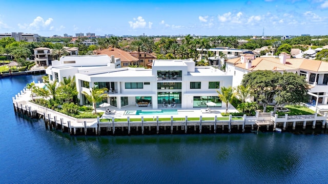 birds eye view of property featuring a water view and a residential view