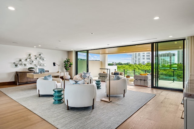 living room featuring floor to ceiling windows and wood-type flooring