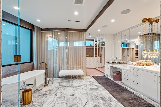 bathroom with vanity, tile walls, and a washtub