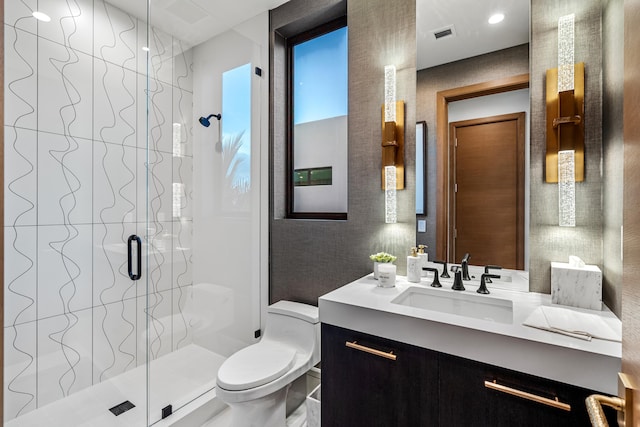 bathroom with vanity, toilet, and an enclosed shower