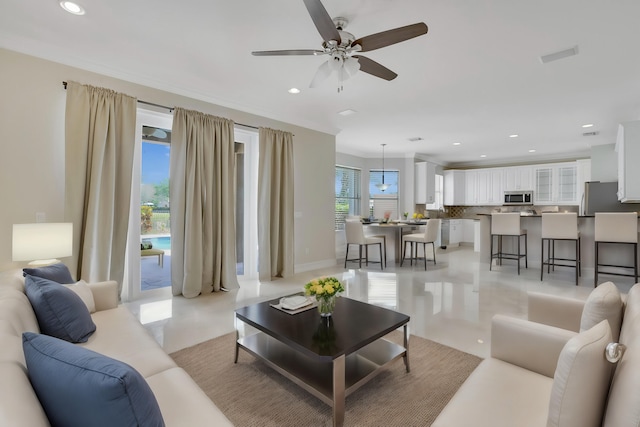 tiled living room with ceiling fan