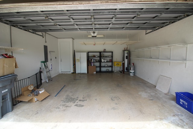 garage featuring a garage door opener and electric water heater